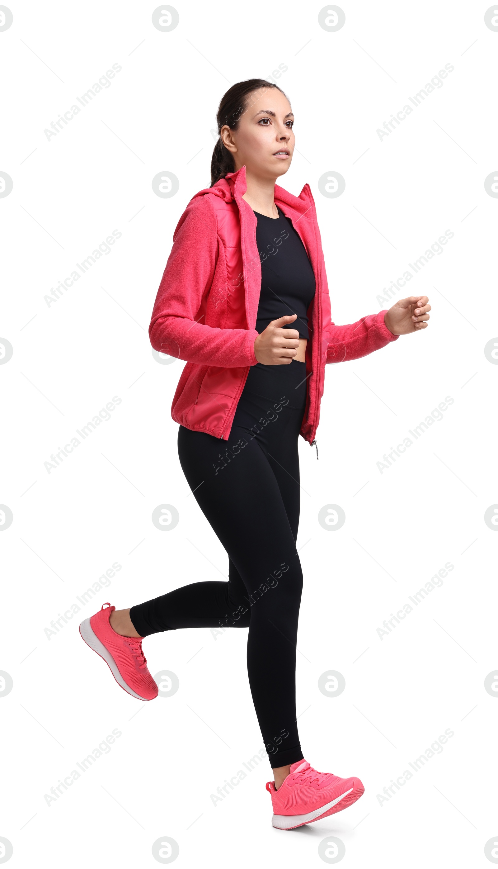 Photo of Athletic woman in sportswear running on white background