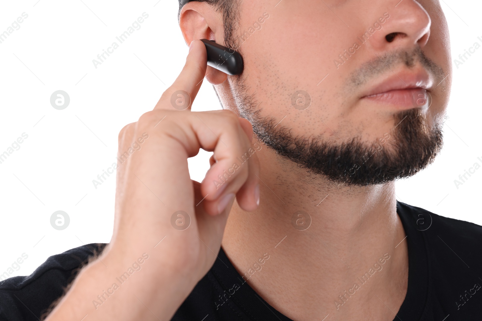 Photo of Young bodyguard with earpiece isolated on white, closeup