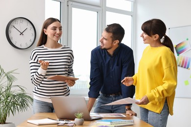 Group of designers working together in office