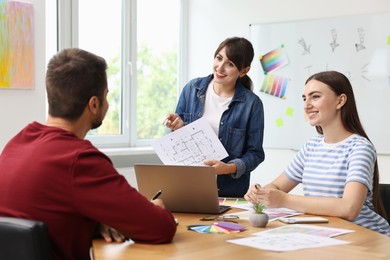 Group of designers working together in office