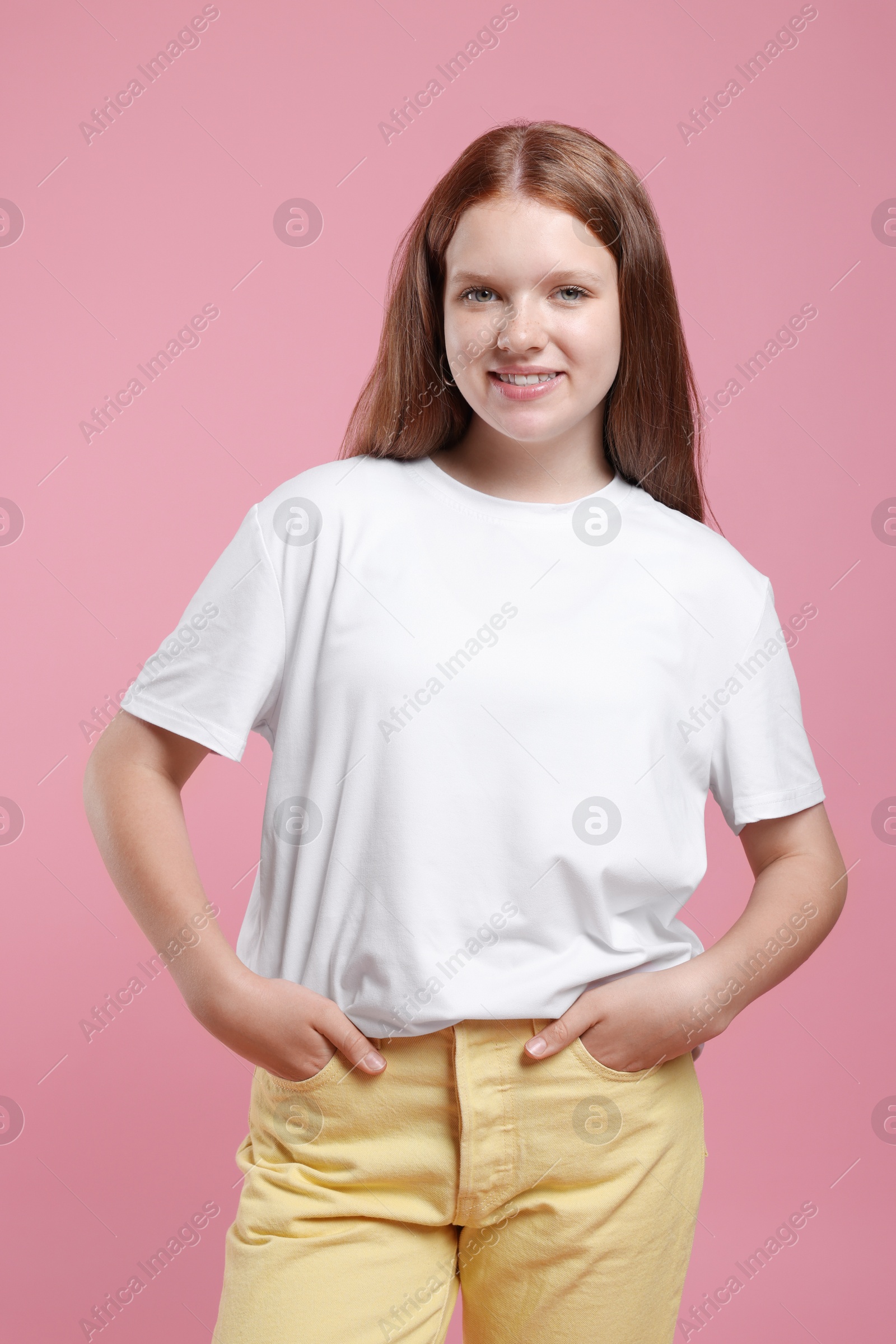 Photo of Portrait of teenage girl on pink background