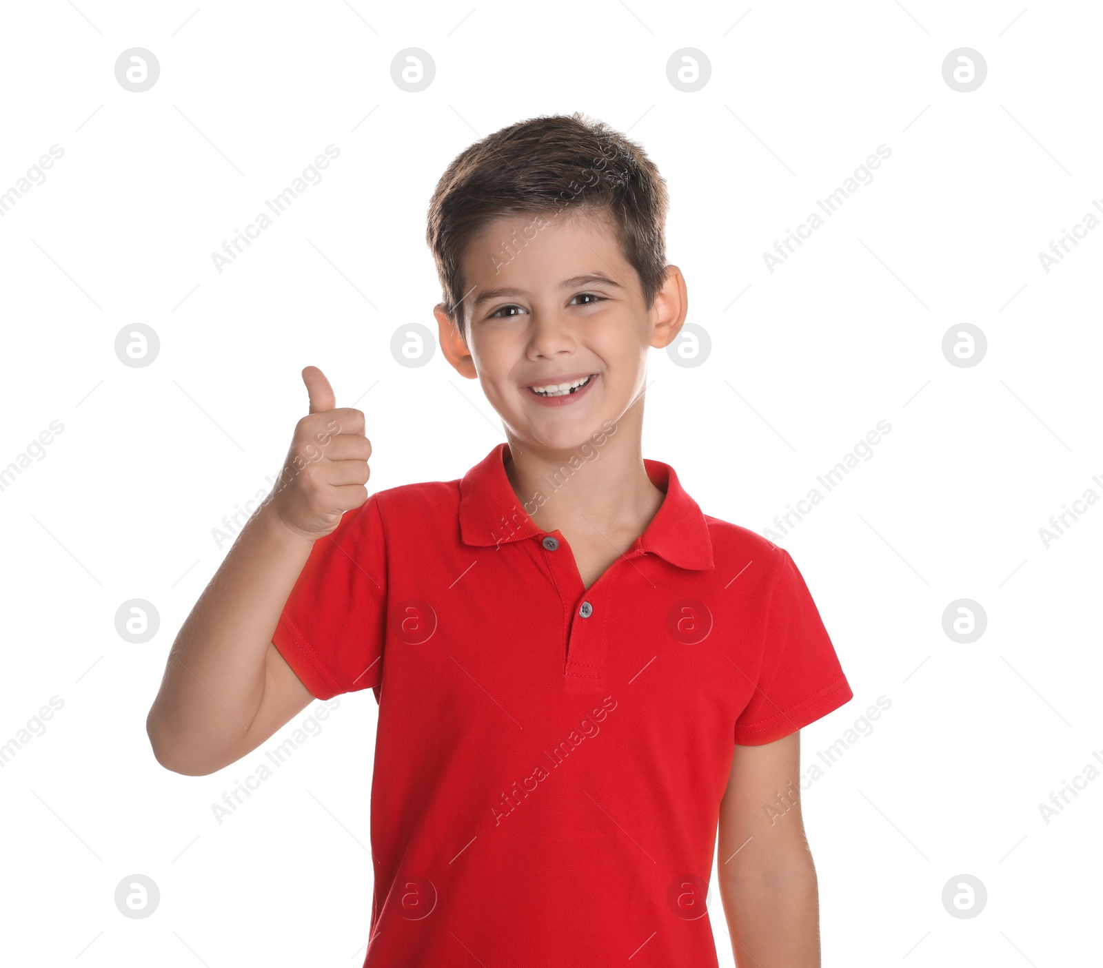 Photo of Cute little boy showing thumbs up on white background