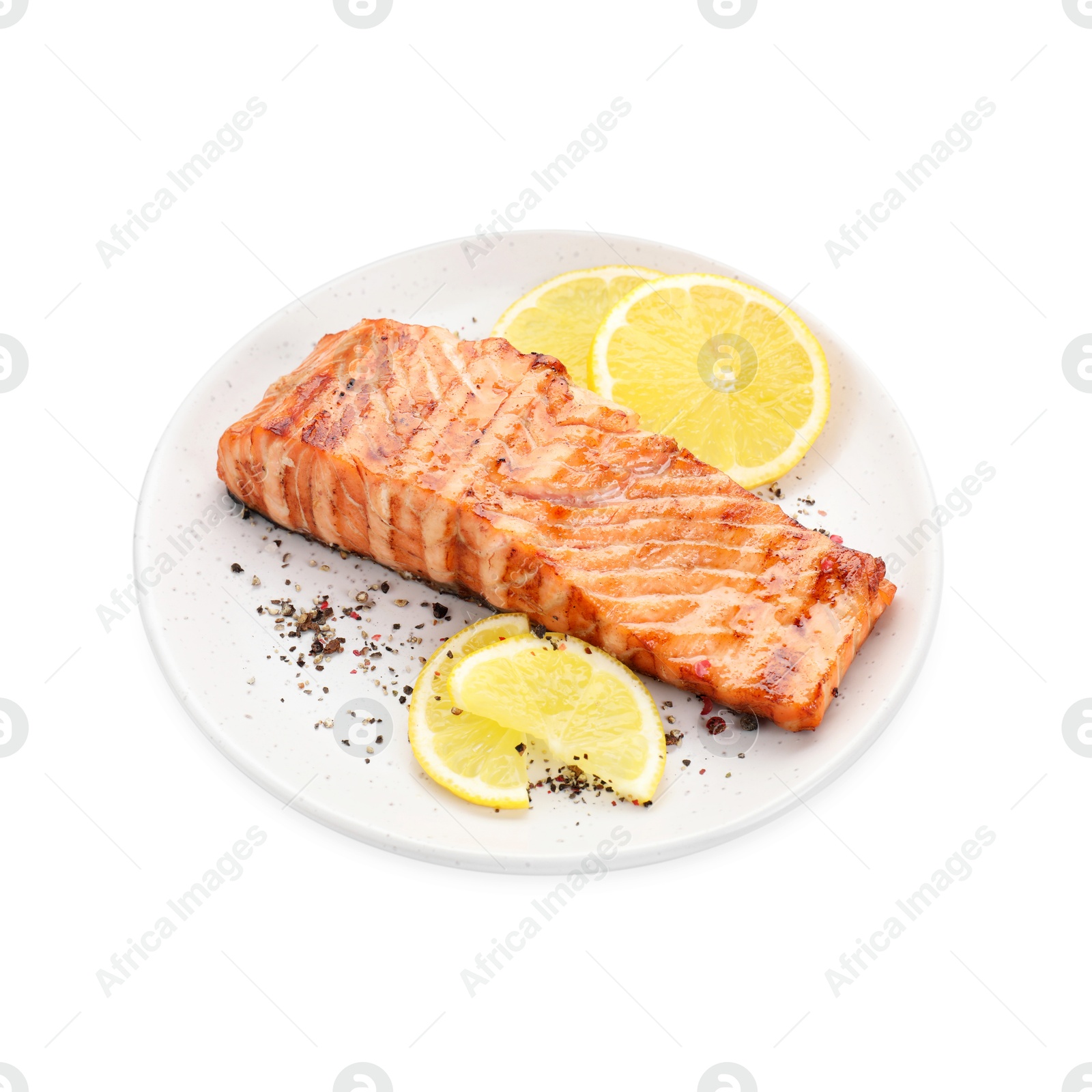 Photo of Delicious grilled salmon fillet with lemon slices and spices isolated on white