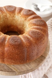 Photo of Freshly baked sponge cake on table, closeup