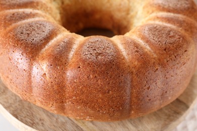 Photo of Freshly baked sponge cake on table, closeup