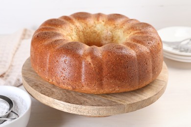 Freshly baked sponge cake on table, closeup