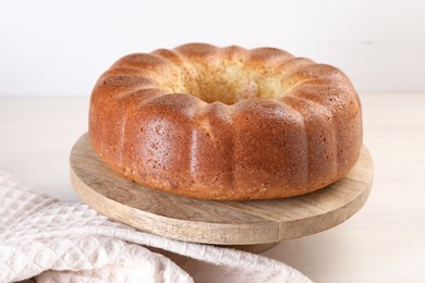 Freshly baked sponge cake on table, closeup