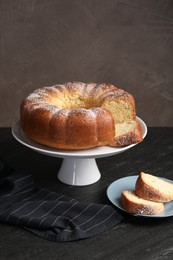 Freshly baked sponge cake on black table