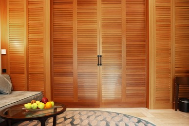 Stylish wooden sliding doors in hotel room