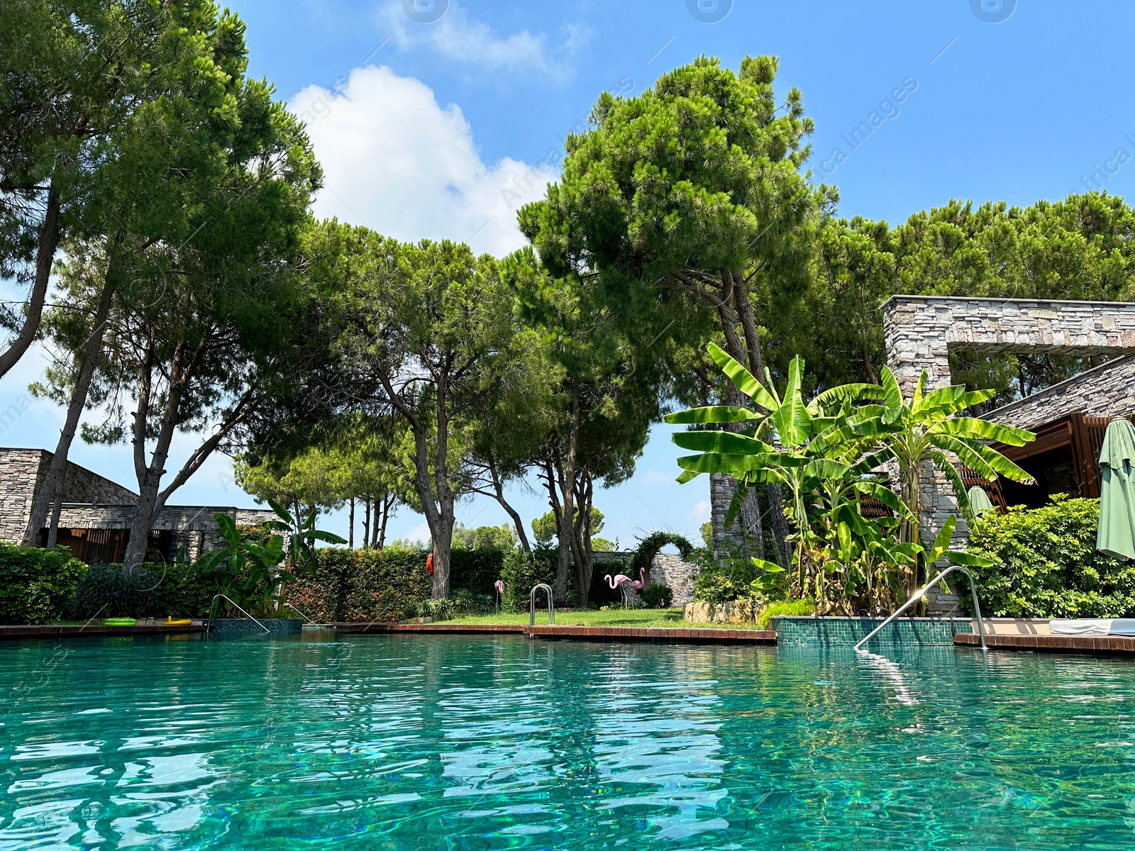 Photo of Outdoor swimming pool with clear water at luxury resort