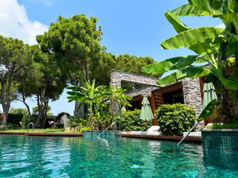 Outdoor swimming pool with clear water at luxury resort