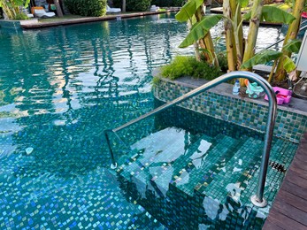 Photo of Outdoor swimming pool with clear water at luxury resort