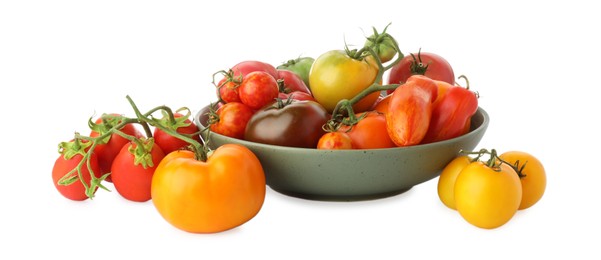 Photo of Different ripe tomatoes in bowl isolated on white