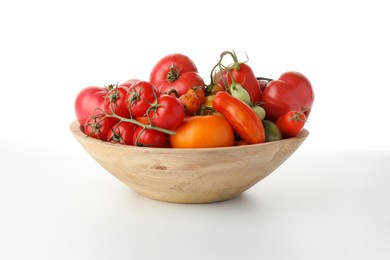 Photo of Different ripe tomatoes in bowl on white background