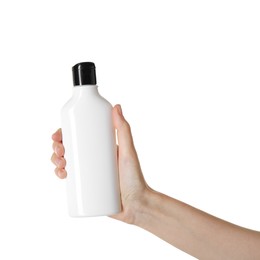 Woman with shampoo bottle on white background, closeup