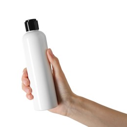 Photo of Woman with shampoo bottle on white background, closeup