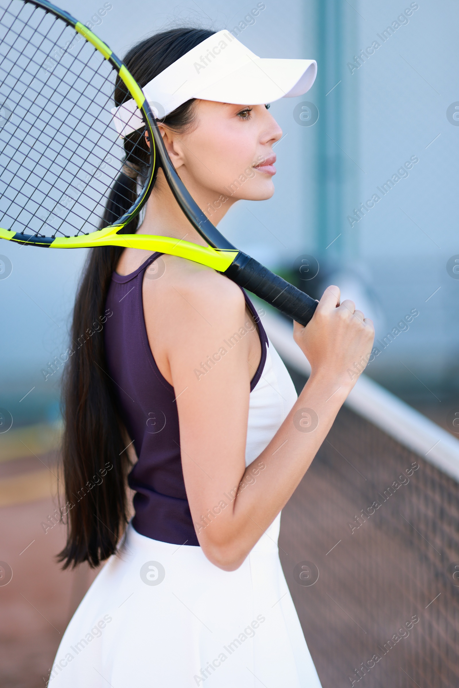 Photo of Beautiful woman with tennis racket on court