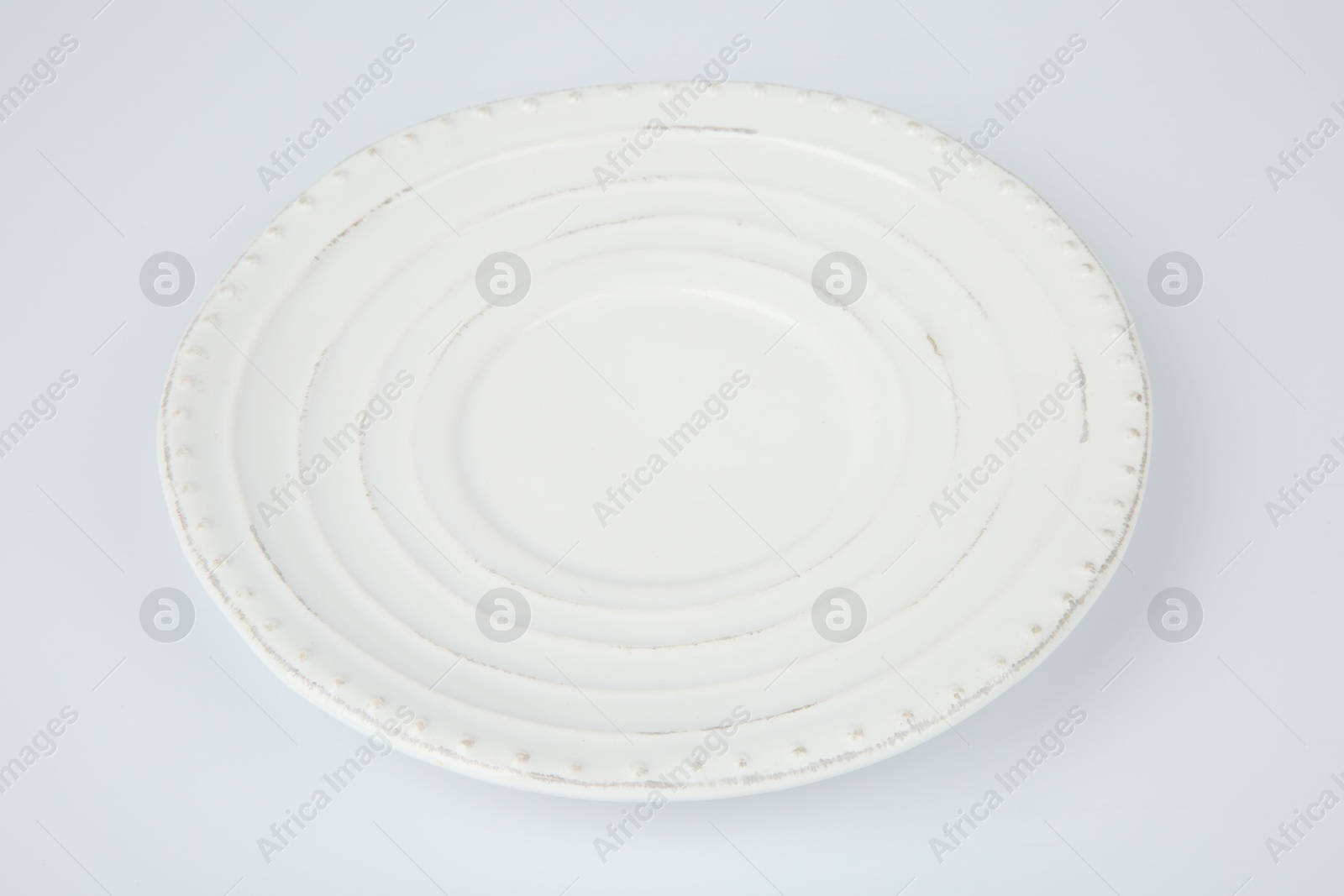 Photo of One empty ceramic plate on white background