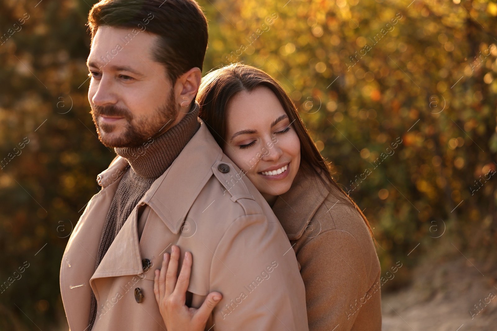 Photo of Lovely couple hugging in beautiful autumn park