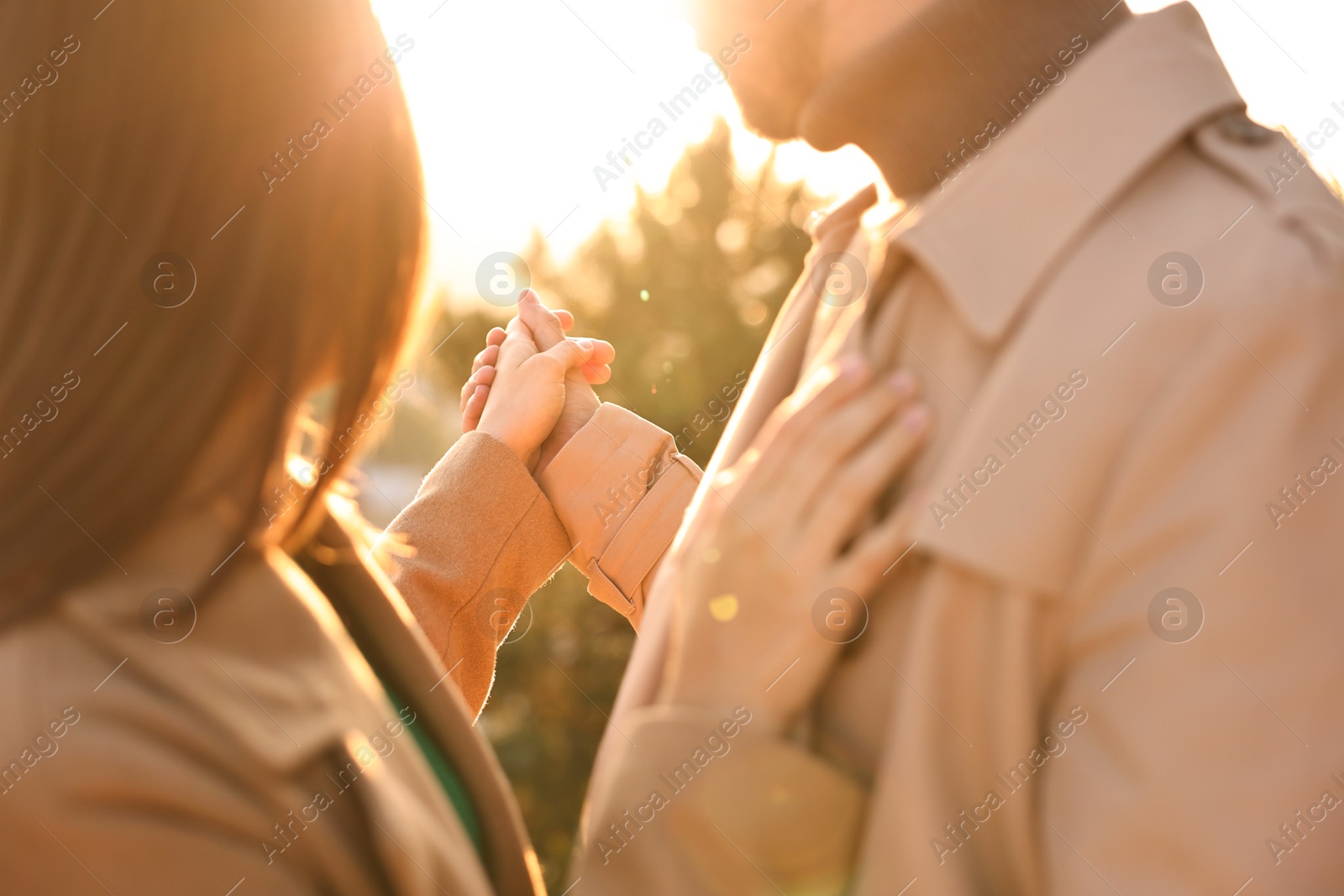 Photo of Beautiful couple dancing outdoors on sunset, closeup