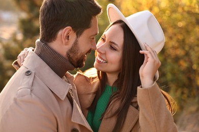 Beautiful couple spending time together in autumn park