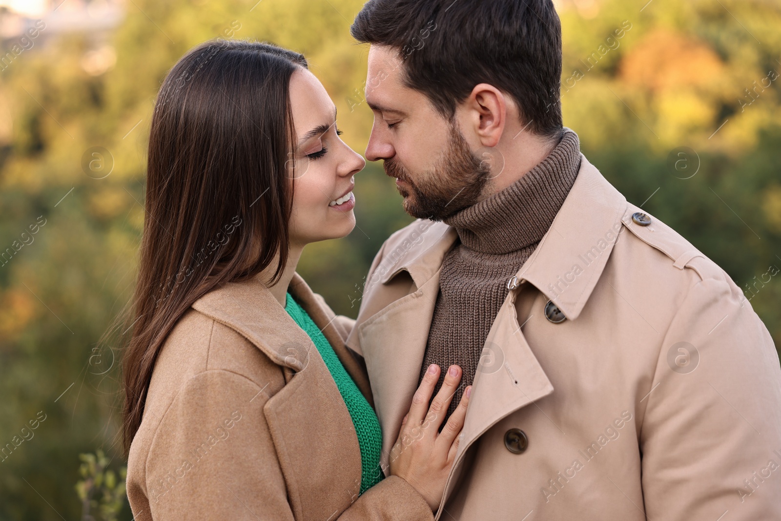 Photo of Beautiful couple spending time together outdoors on autumn day