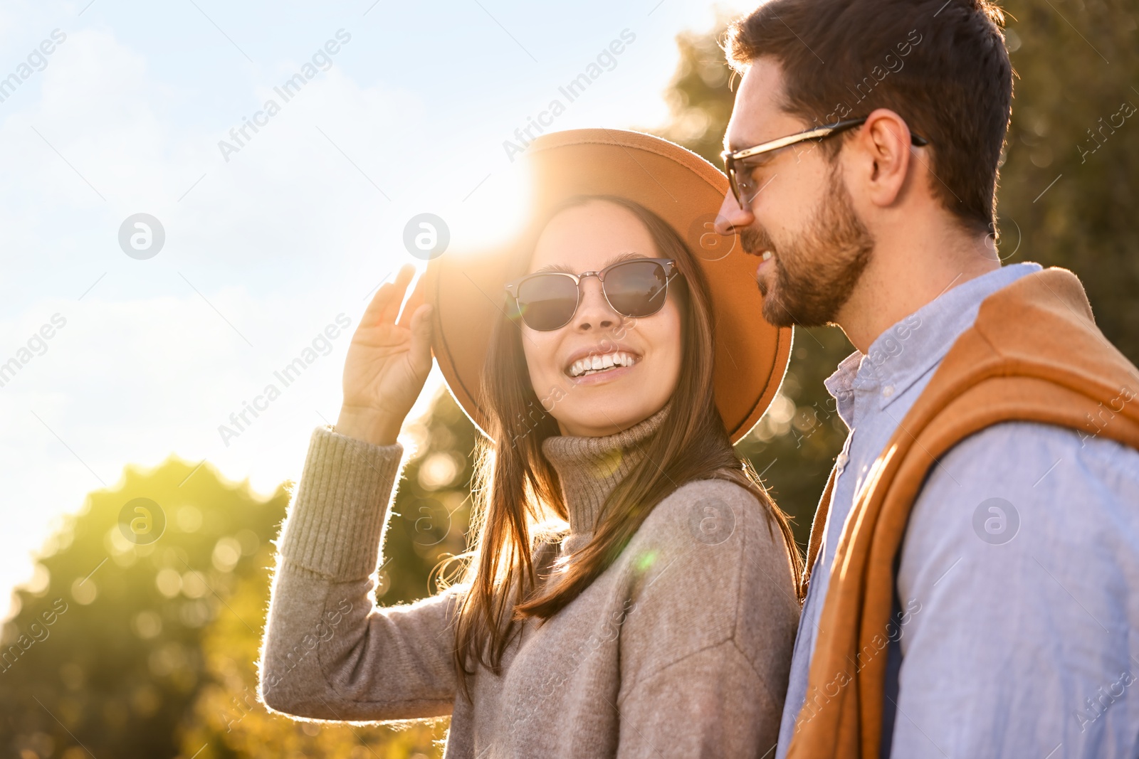 Photo of Beautiful couple spending time together in autumn park