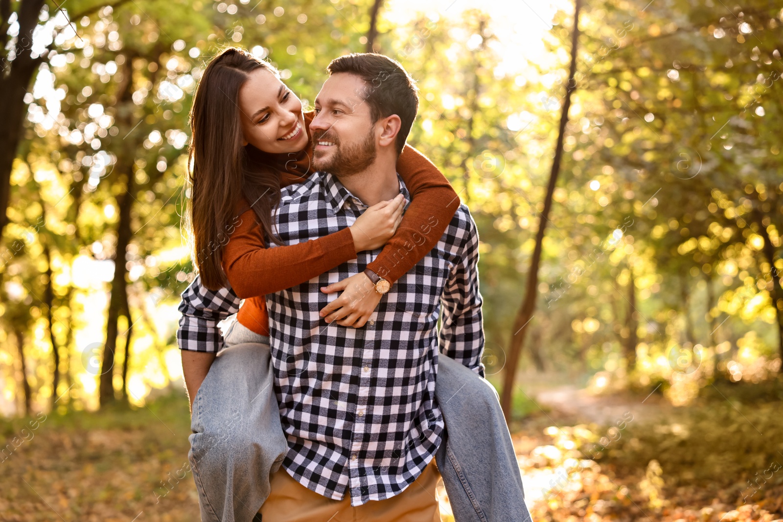 Photo of Beautiful couple having fun together in park on autumn day