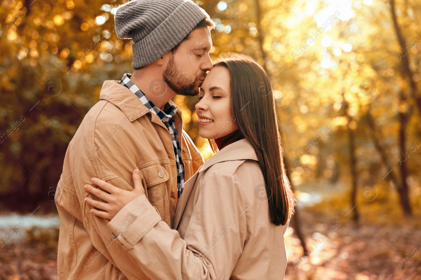 Photo of Beautiful couple spending time in park on autumn day