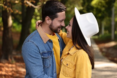 Beautiful couple in park on autumn day