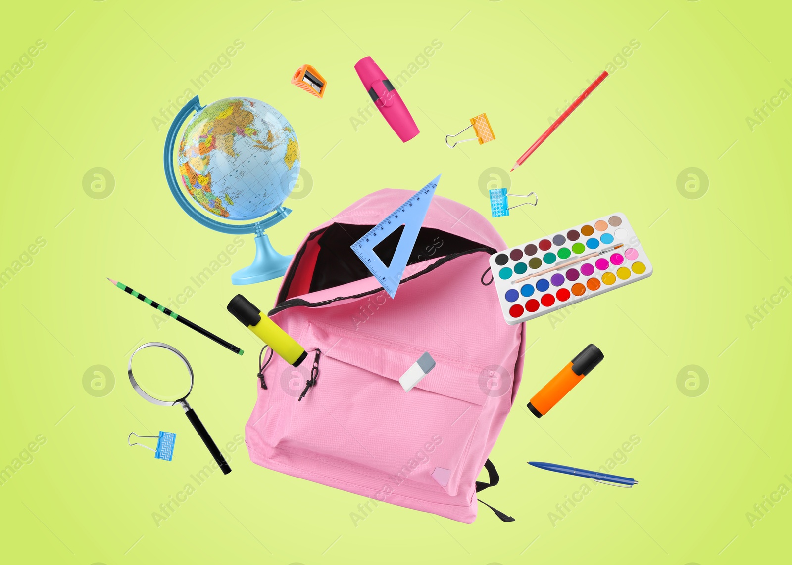 Image of Pink backpack and school stationery in air on light green background