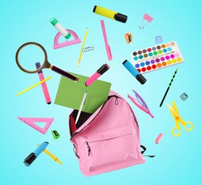 Pink backpack and school stationery in air on light blue background