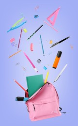 Image of Pink backpack and school stationery in air on violet blue background