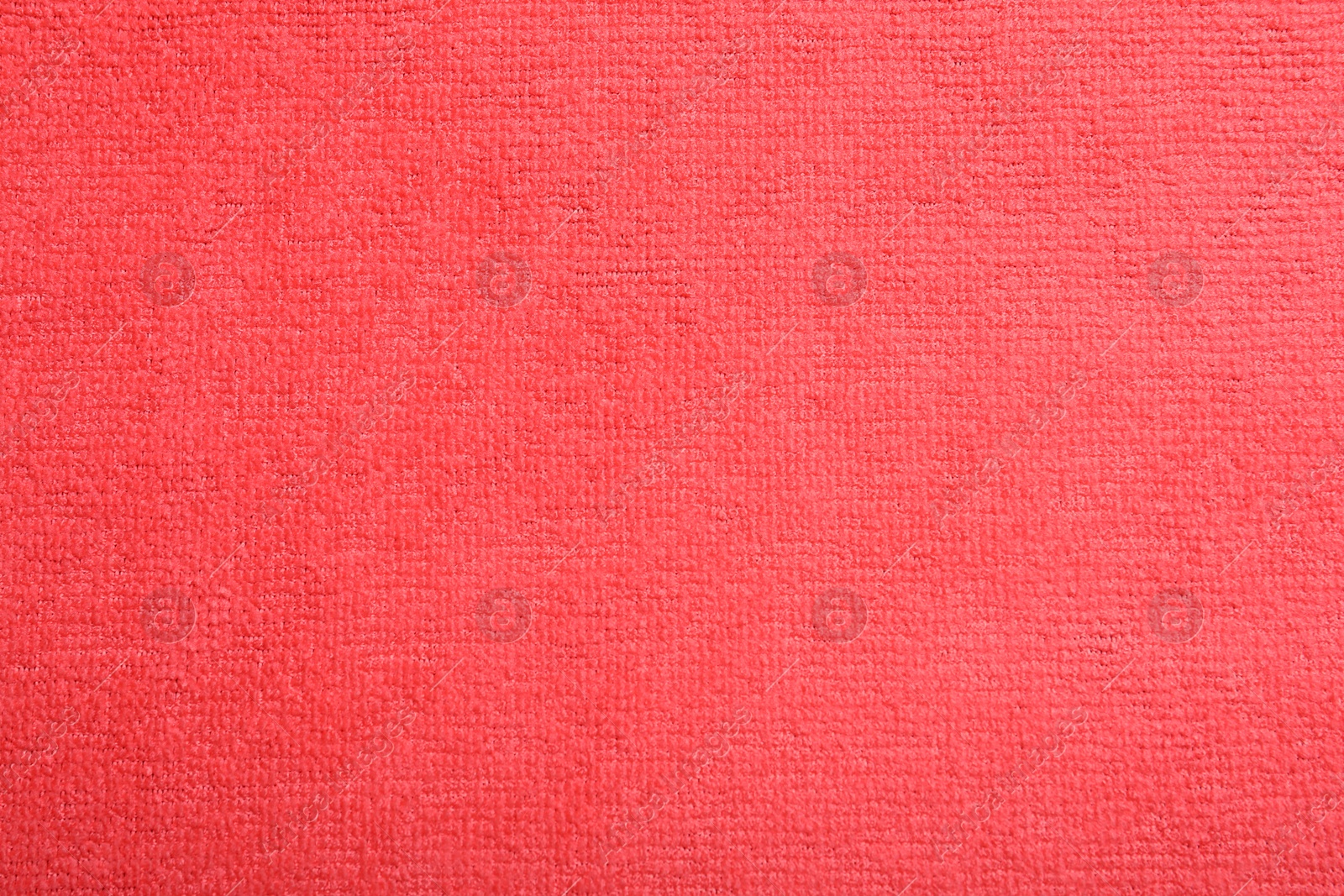 Photo of Red microfiber cloth as background, top view