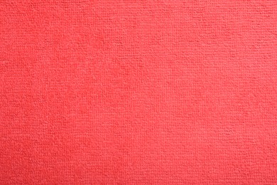 Photo of Red microfiber cloth as background, top view