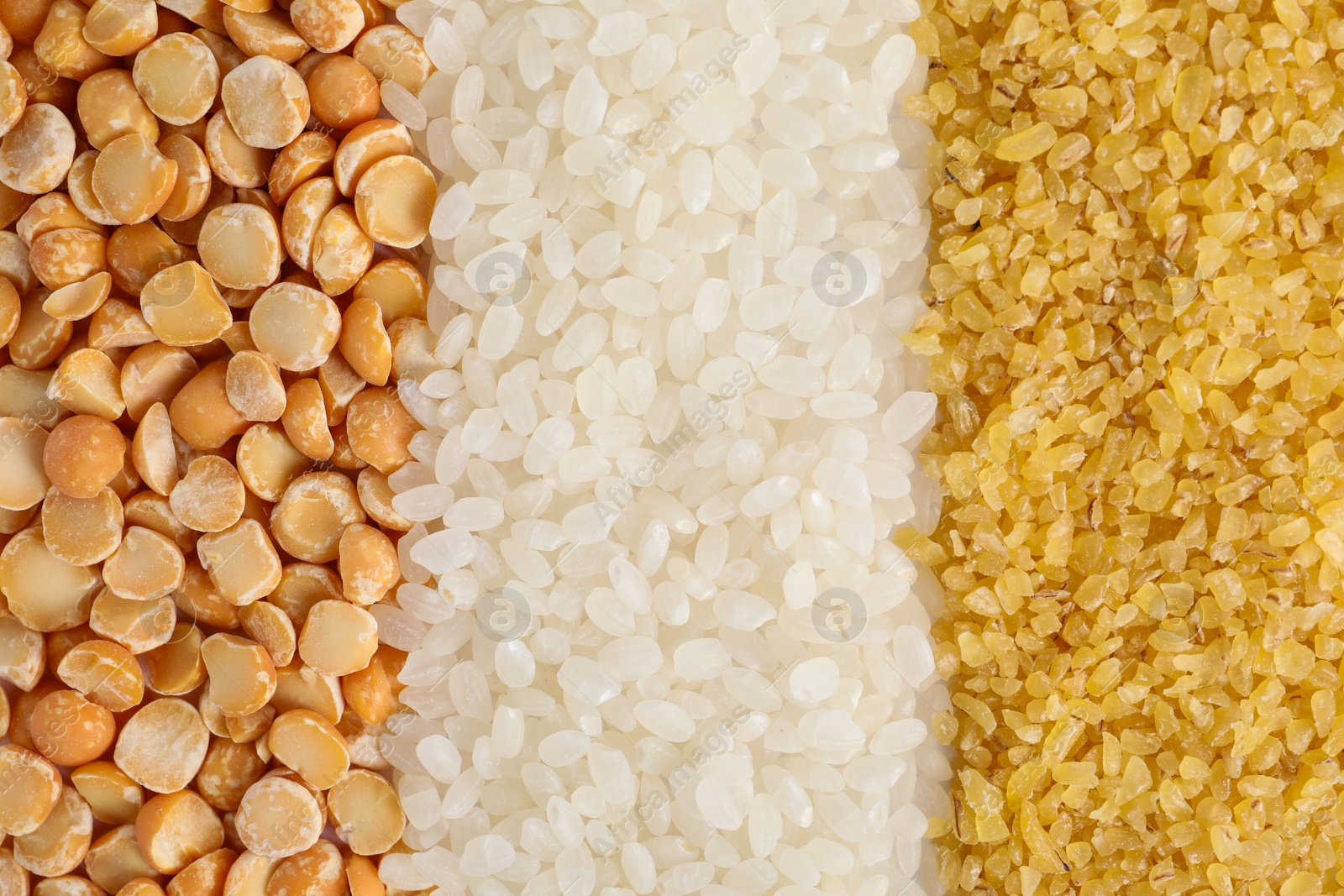 Photo of Different cereal grains as background, top view