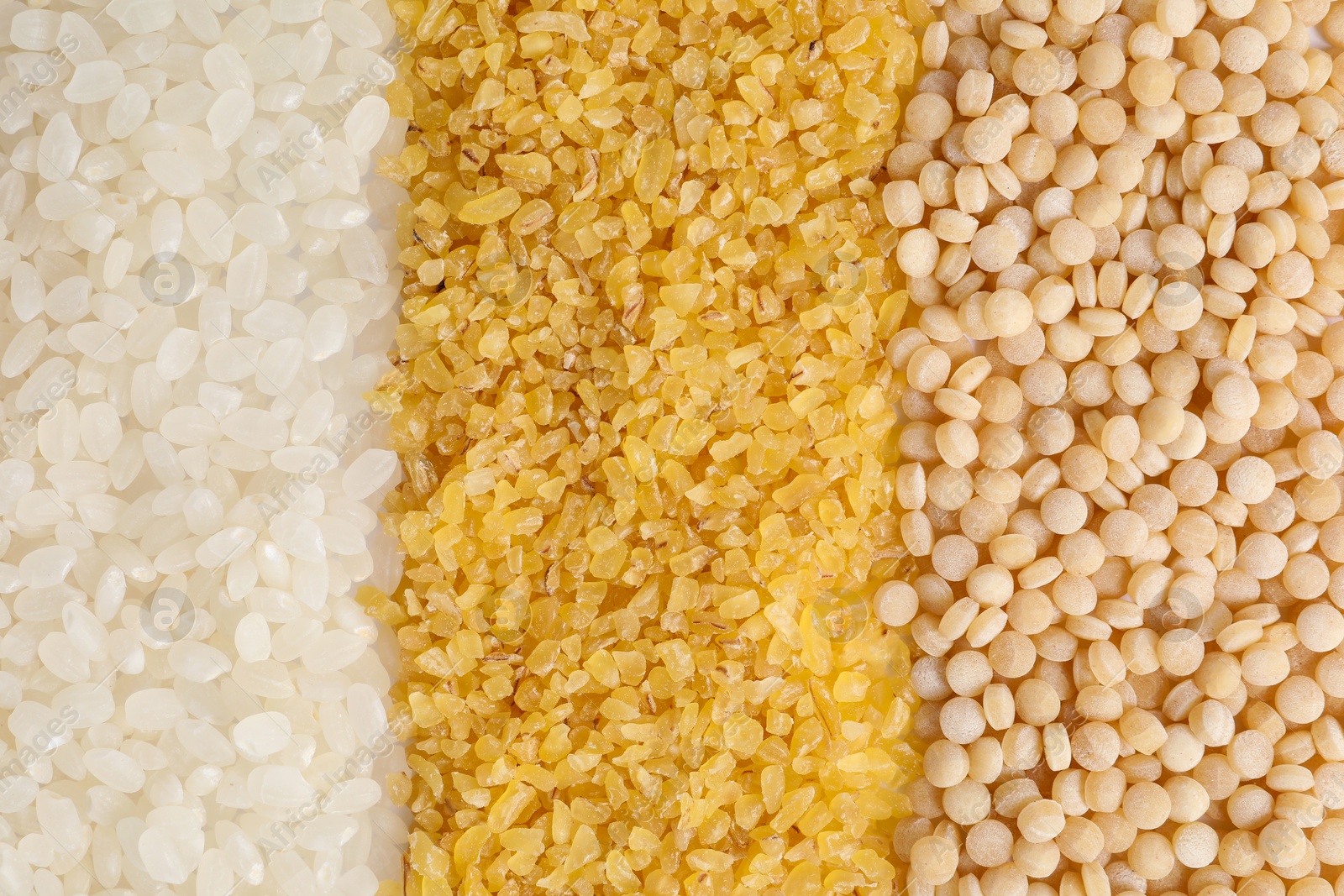 Photo of Different cereal grains as background, top view