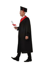 Happy student with diploma after graduation on white background