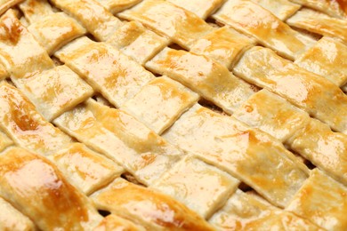 Tasty homemade pie as background, closeup view