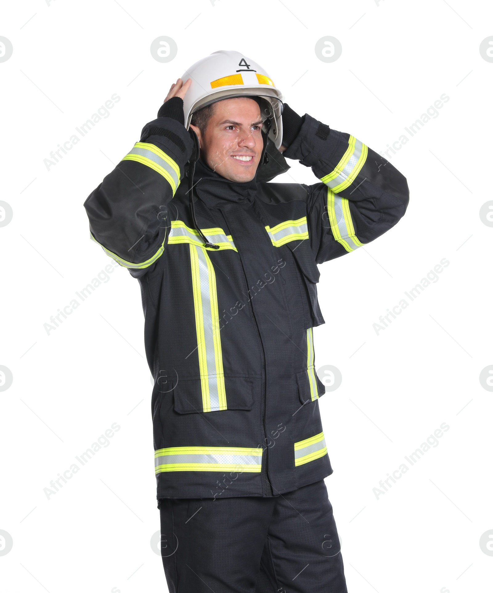 Photo of Portrait of firefighter in uniform wearing helmet on white background