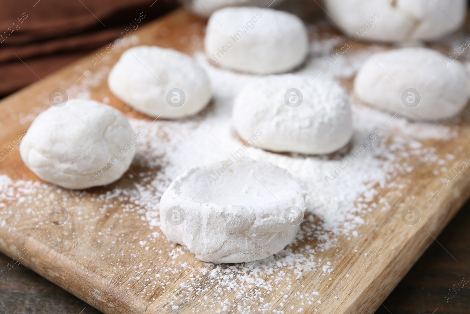 Photo of Dough for tasty homemade mochi on wooden table, closeup