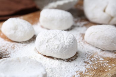 Photo of Dough for tasty homemade mochi on wooden table, closeup