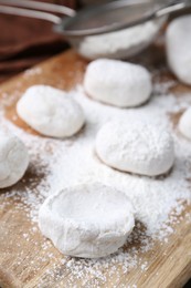 Dough for tasty homemade mochi on wooden table, closeup