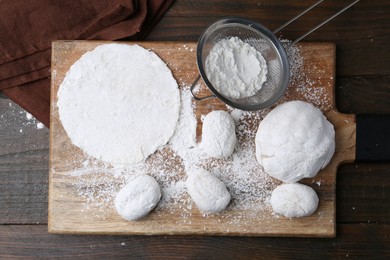 Photo of Dough for tasty homemade mochi on wooden table, top view