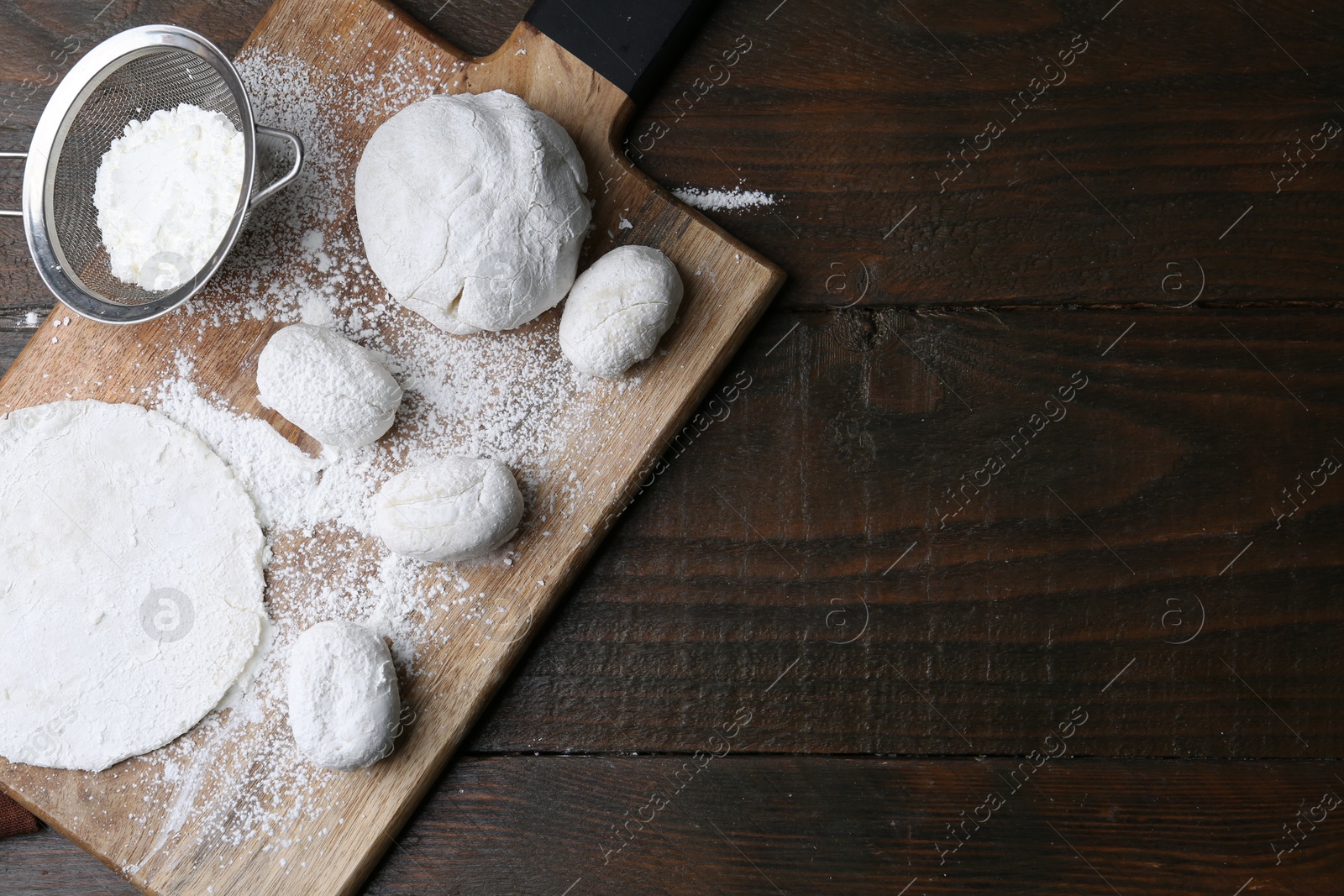 Photo of Dough for tasty homemade mochi on wooden table, top view. Space for text