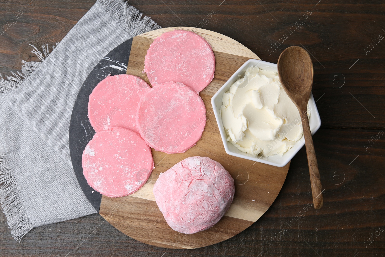 Photo of Dough for tasty homemade mochi on wooden table, top view