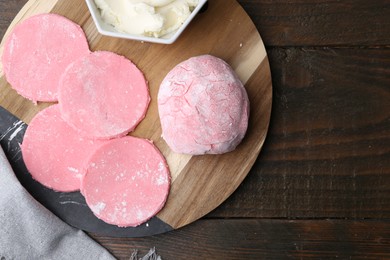 Dough for tasty homemade mochi on wooden table, top view. Space for text