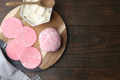 Photo of Dough for tasty homemade mochi on wooden table, top view. Space for text