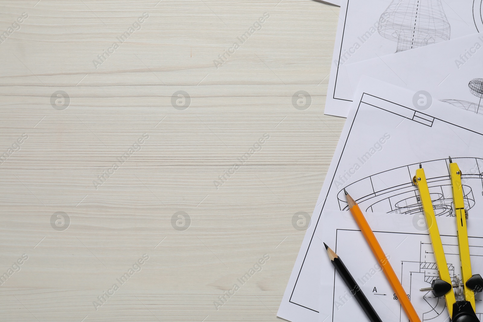 Photo of Different engineering drawings, pencils and divider on wooden table, flat lay. Space for text