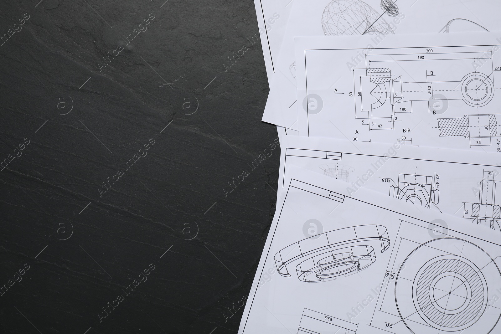 Photo of Different engineering drawings on grey textured table, flat lay. Space for text